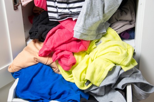 Weather-protected enclosed skip in a residential area